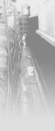 Builder working on foundation